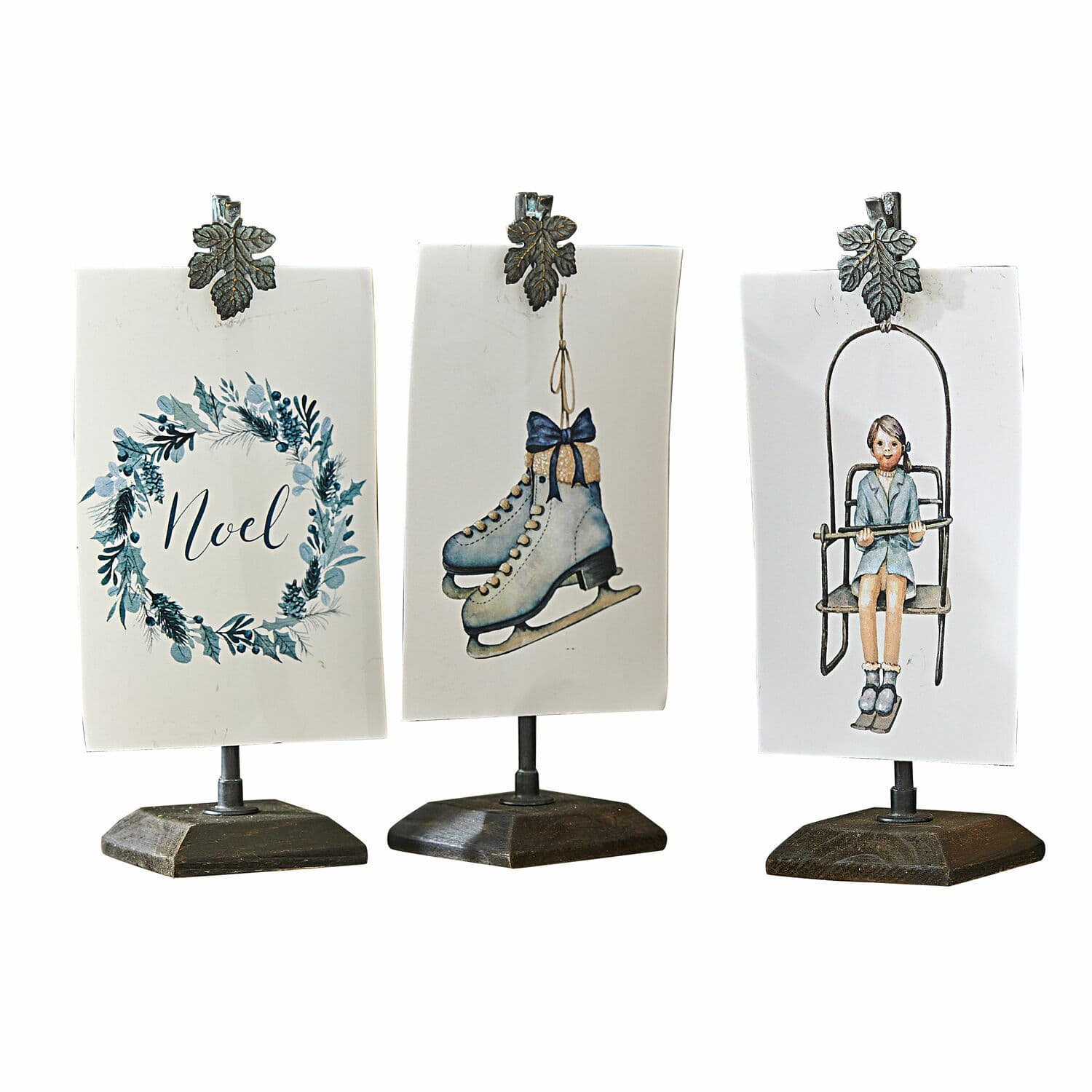 Set di 3 porta stampe con clip Herveline Tre decorazioni natalizie su supporti con clip metalliche, motivi pattini, bambina e scritta Noel