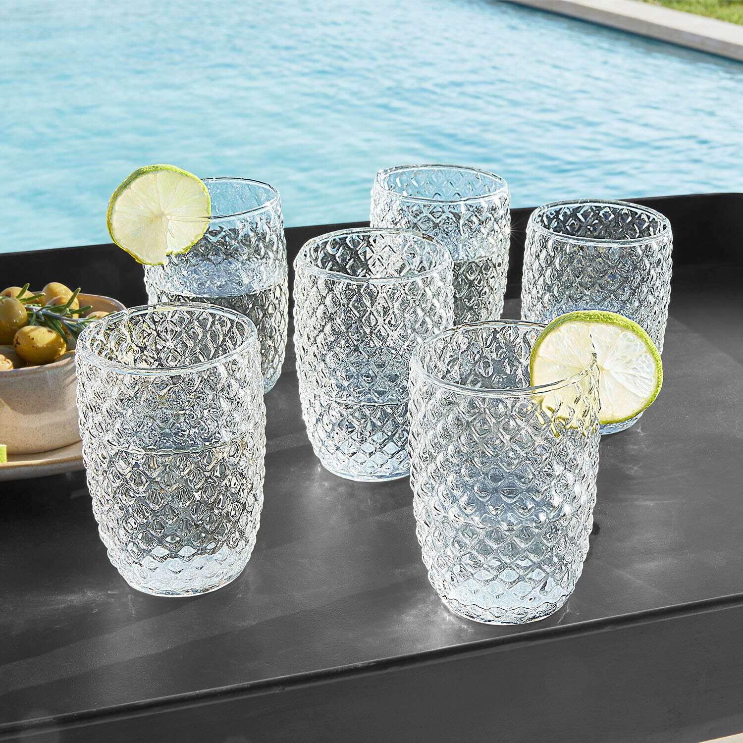 Set di 6 bicchieri Ivorias Set di sei bicchieri in vetro trasparente con motivo a diamante, perfetti per bevande rinfrescanti