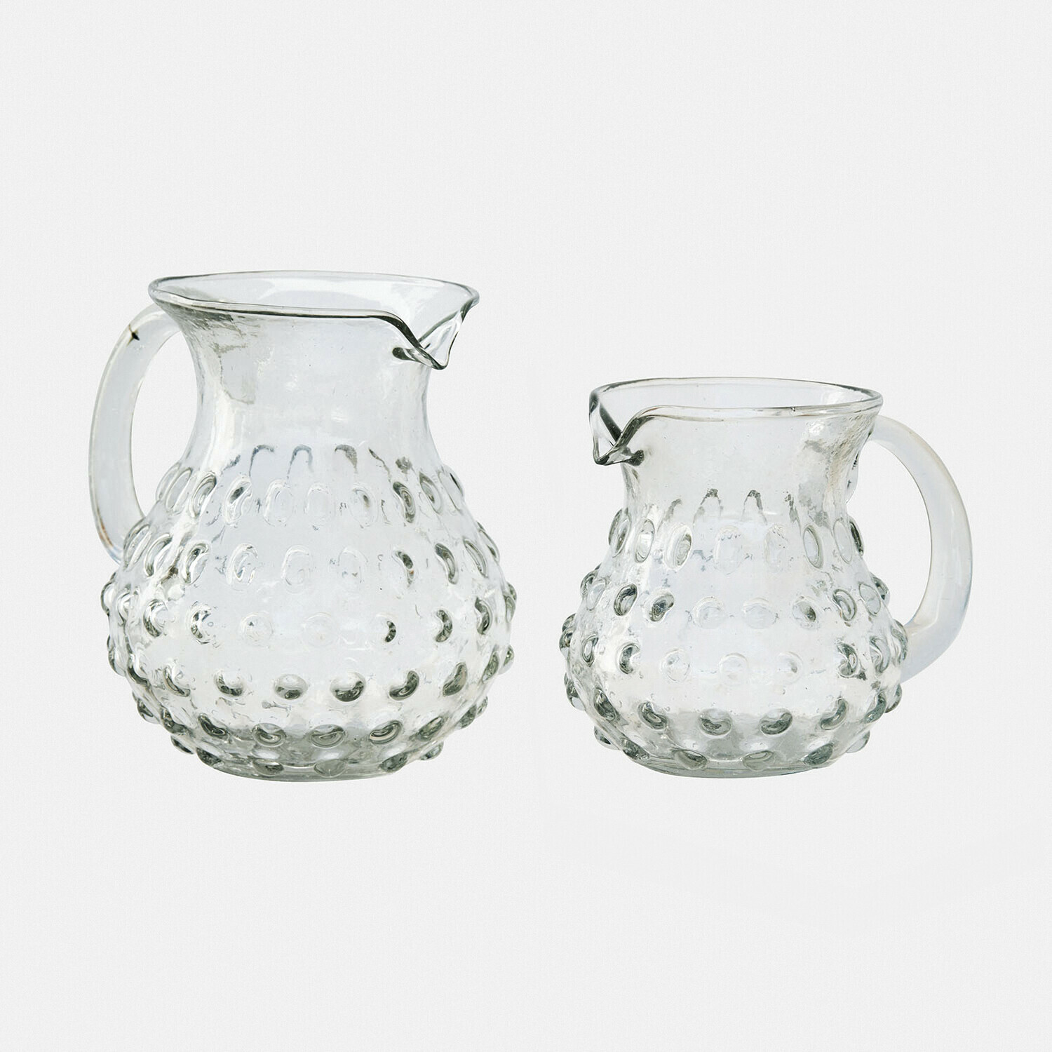Coppia di caraffe Zaleema Set di due brocche in vetro trasparente con motivo a rilievo, contenitori pratici per bevande