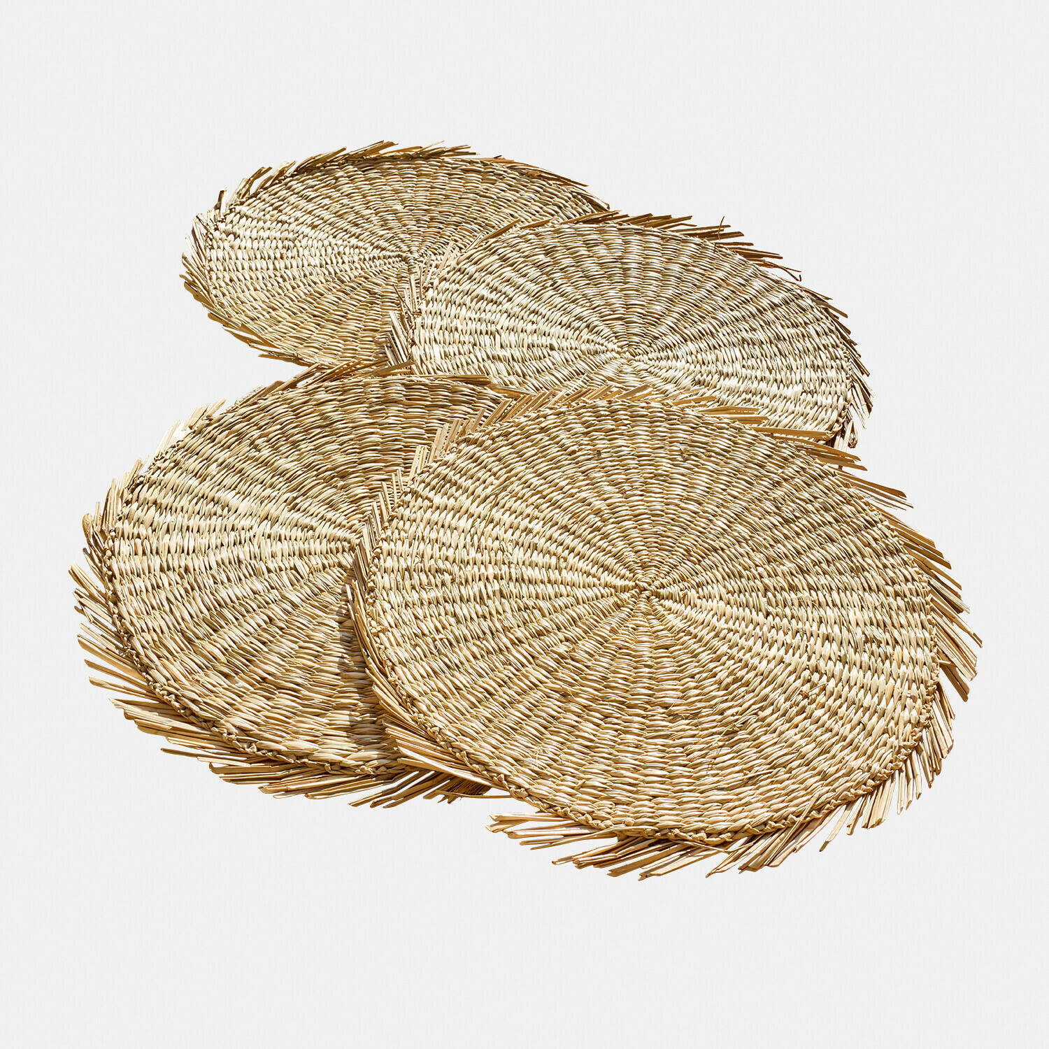 Set di 4 tovagliette Nuviras Set di quattro tovagliette rotonde in paglia naturale di colore marrone chiaro