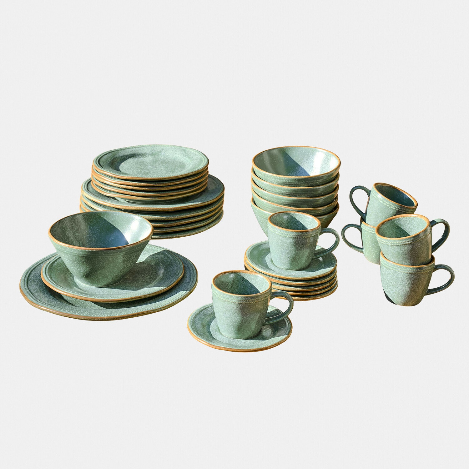 Set di stoviglie in ceramica verde con piatti, tazze e ciotole per uso quotidiano