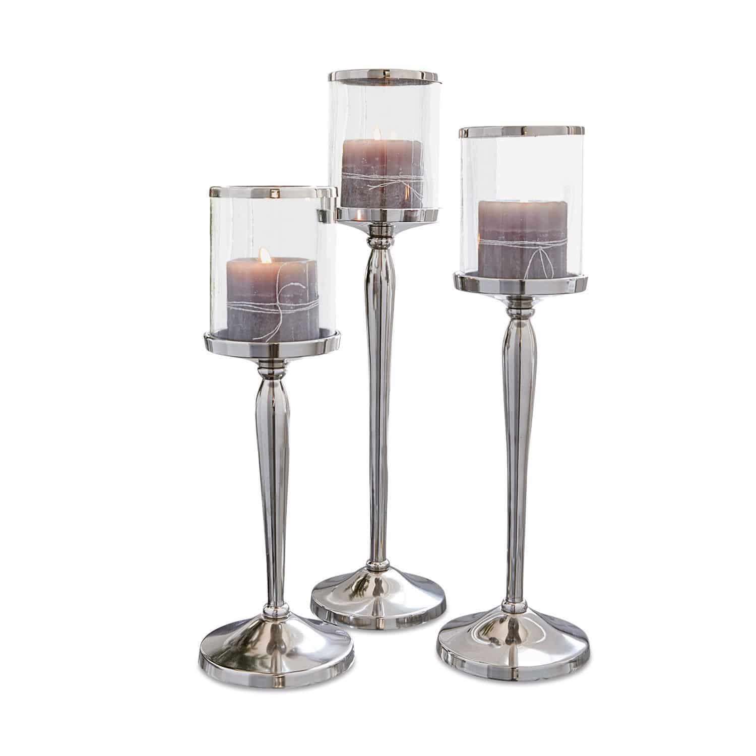 Set di 3 candelieri Serres Set di tre portacandele in metallo e vetro argento con candele decorative grigie