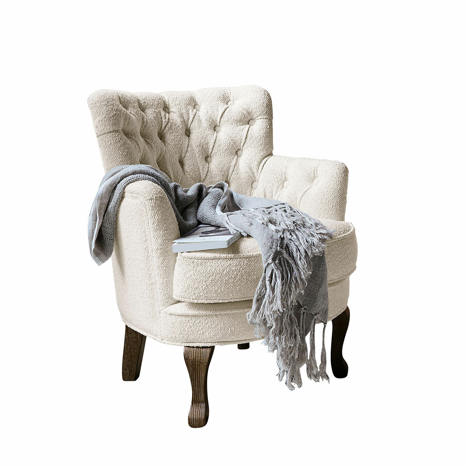 Poltrona Calgary Poltrona beige in tessuto bouclé con gambe in legno scuro, coperta grigia e libro