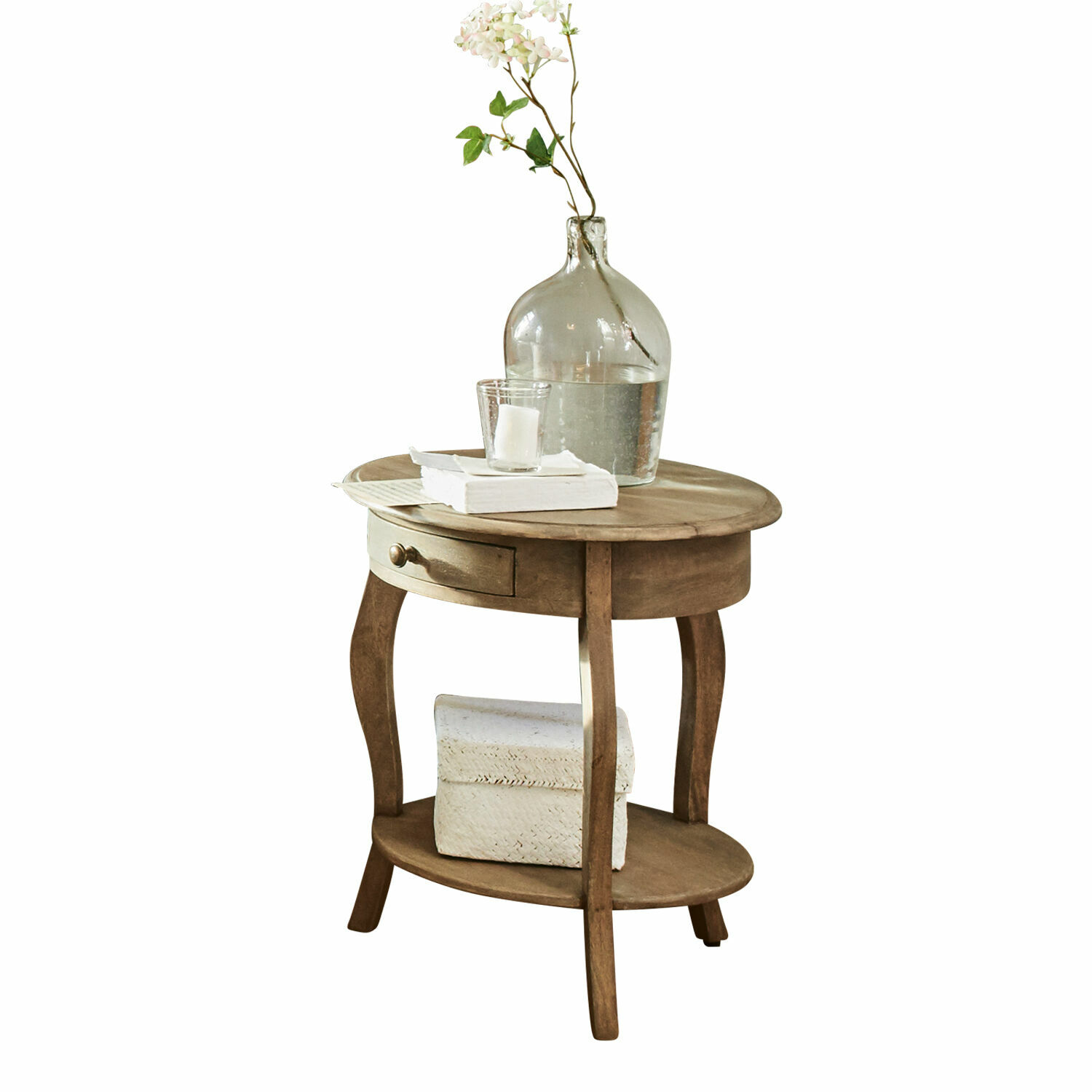 Tavolino di complemento Jace Tavolino rotondo in legno con cassetto e ripiano, decorato con vaso trasparente e libri bianchi