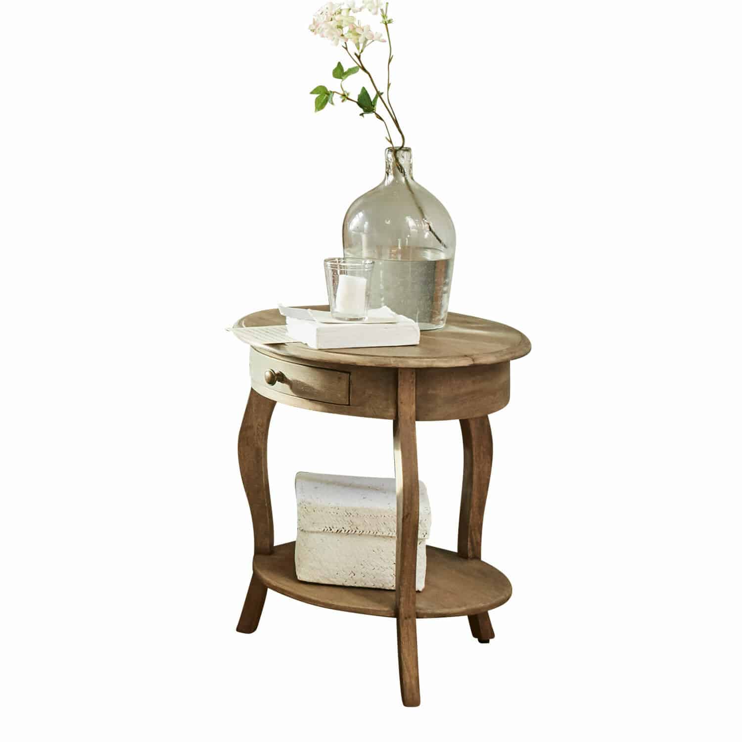 Tavolino di complemento Jace Tavolino rotondo in legno con cassetto e ripiano, decorato con vaso trasparente e libri bianchi