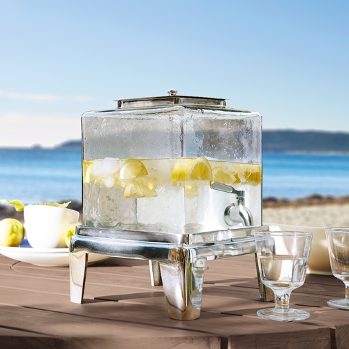 Dispenser per bevande in vetro con base metallica, riempito con acqua al limone, perfetto per feste estive