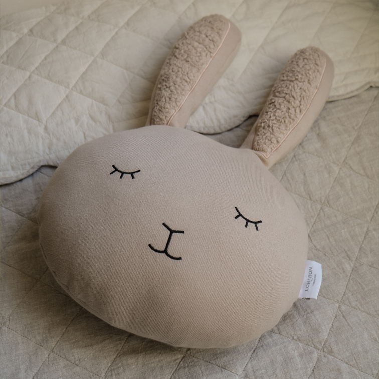 Cuscino beige a forma di coniglio in tessuto morbido con occhi ricamati, decorazione per cameretta