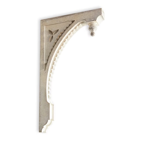 Supporto decorativo in pietra chiara con motivo intagliato e arco per interni classici