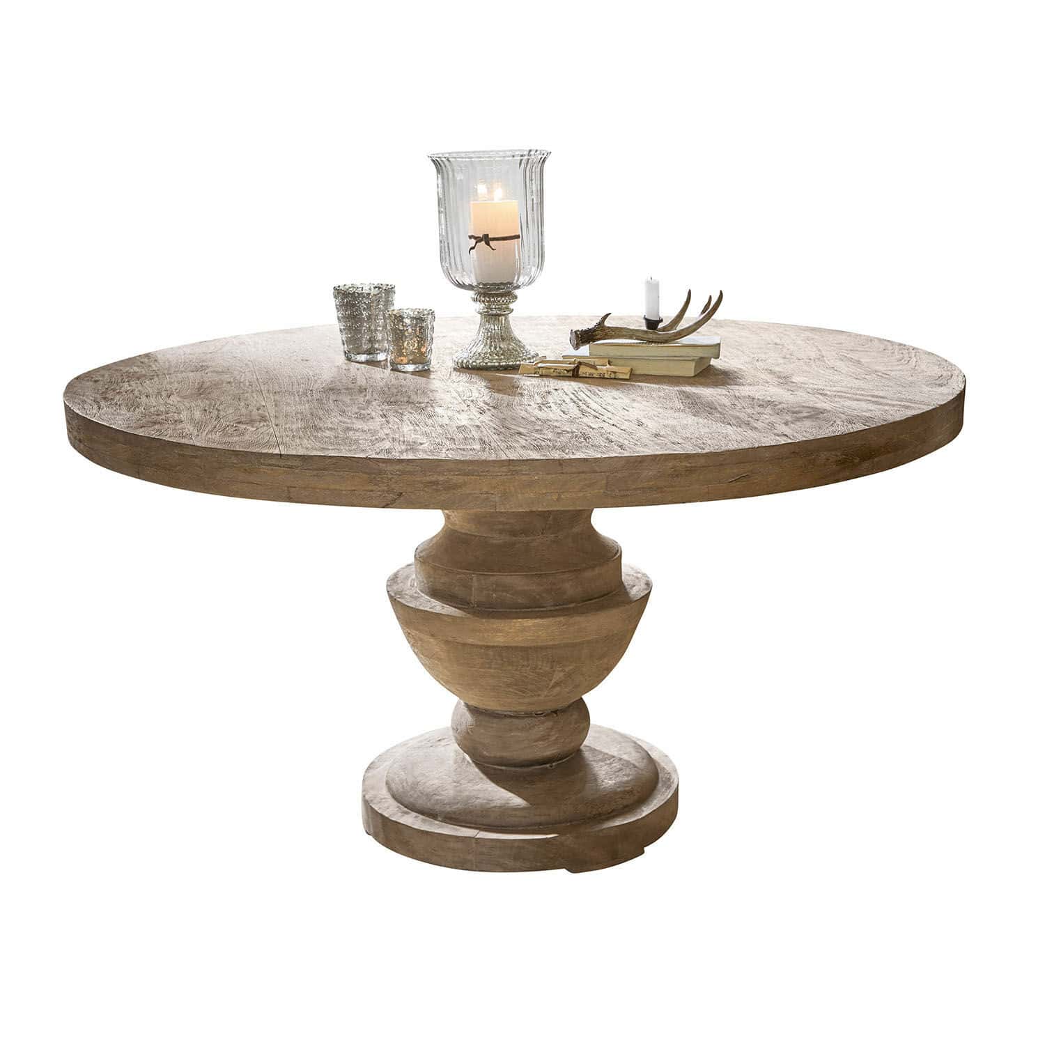 Tavolo Retonfey Tavolo rotondo in legno massello colore naturale con candele decorative e libri sul piano