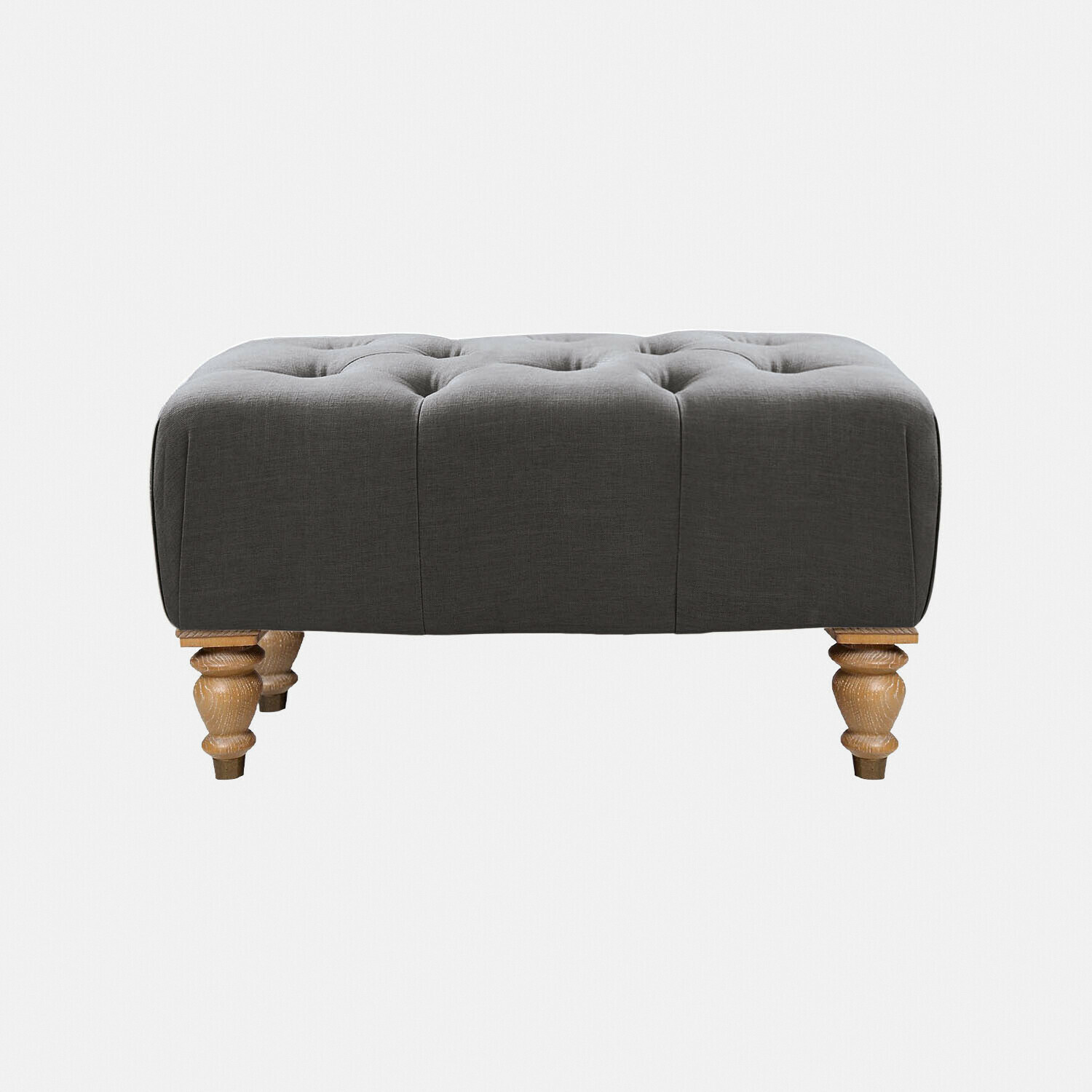 Pouf Durance Pouf grigio trapuntato in tessuto con gambe in legno intagliato per soggiorno