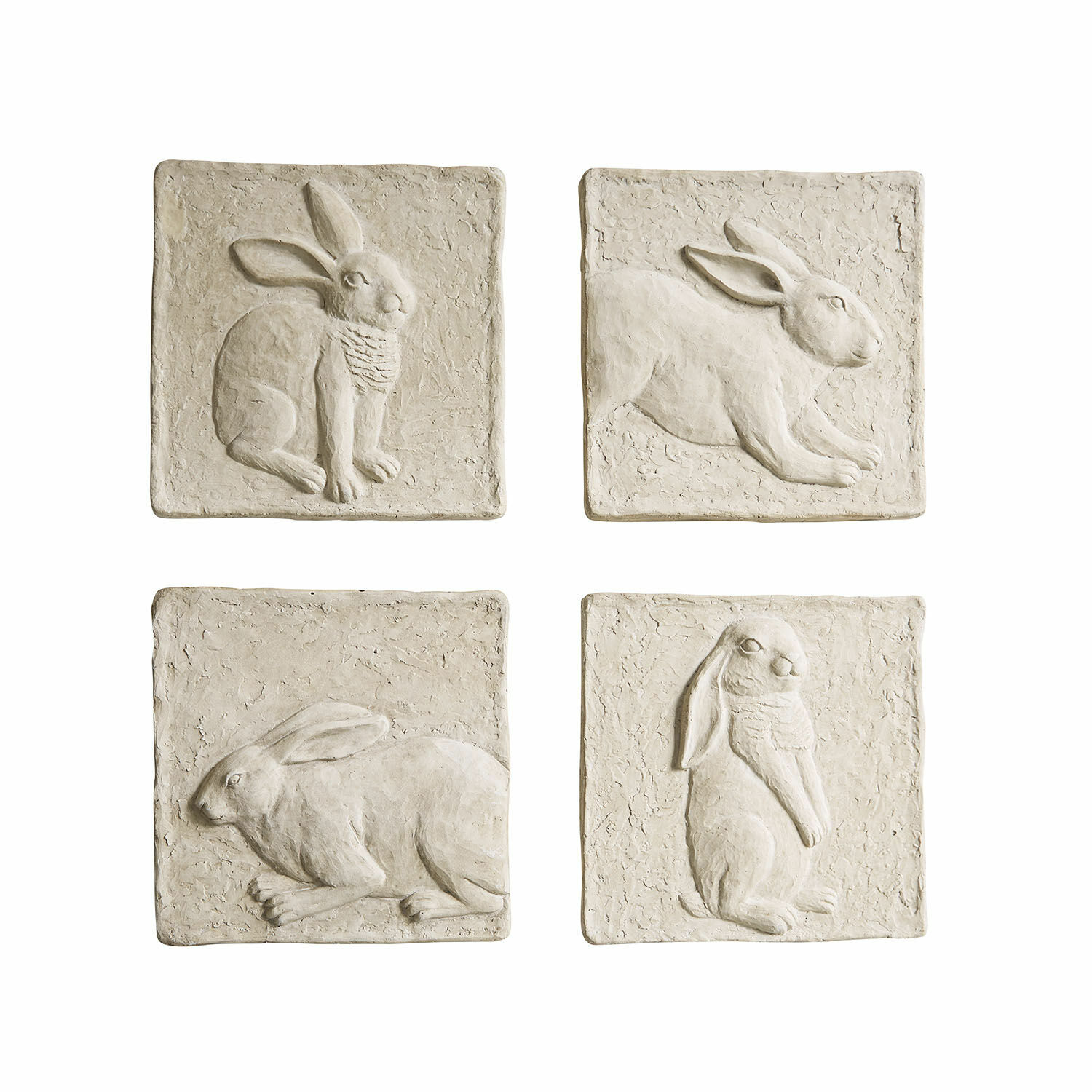 Set di 4 quadretti Cervique Set di quattro piastrelle decorative in pietra beige con rilievi di conigli per decorazione murale